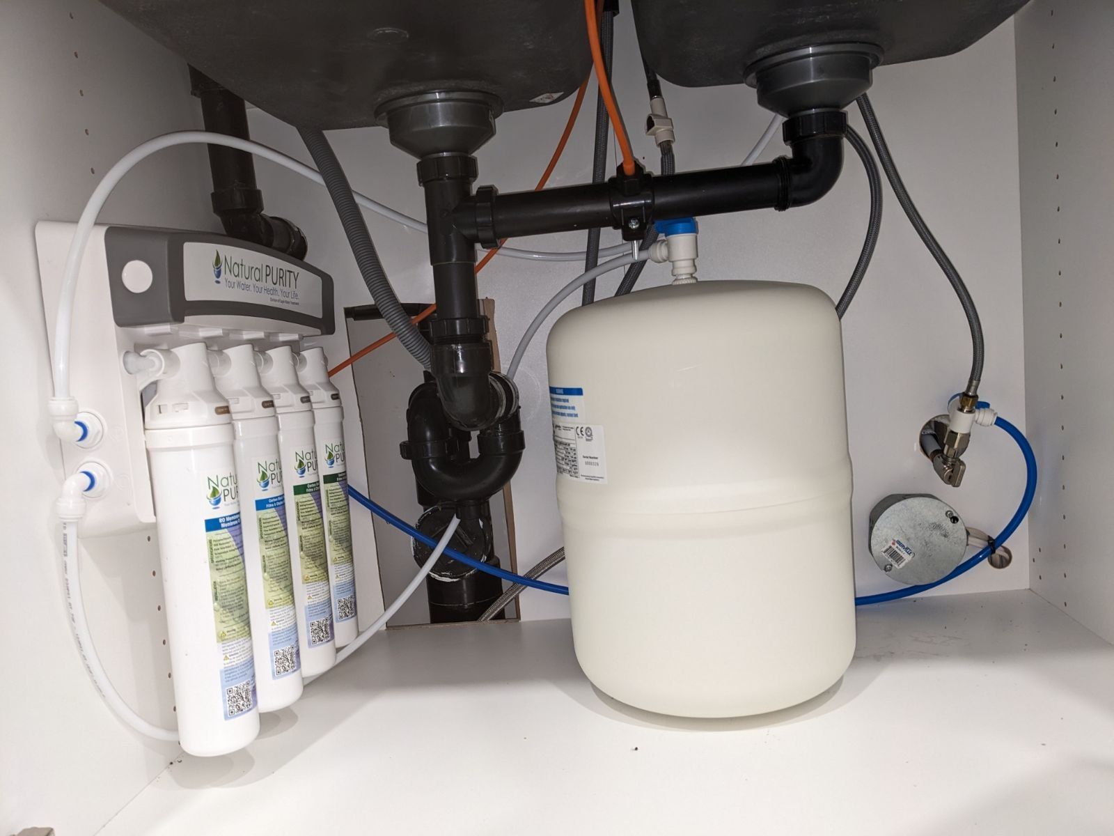 IH2O technician completing a residential water treatment installation